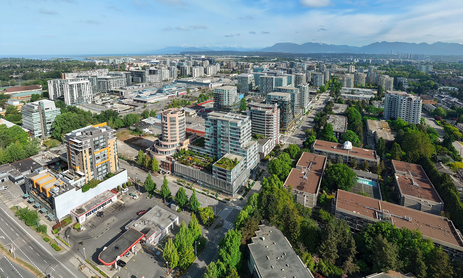 Aerial view of Richmond city centre, BC, with the North Shore mountains behind